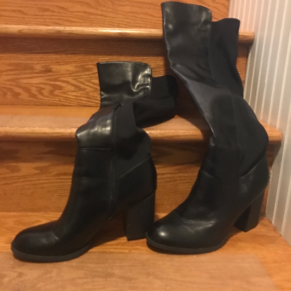 Black knee high boots; large calf